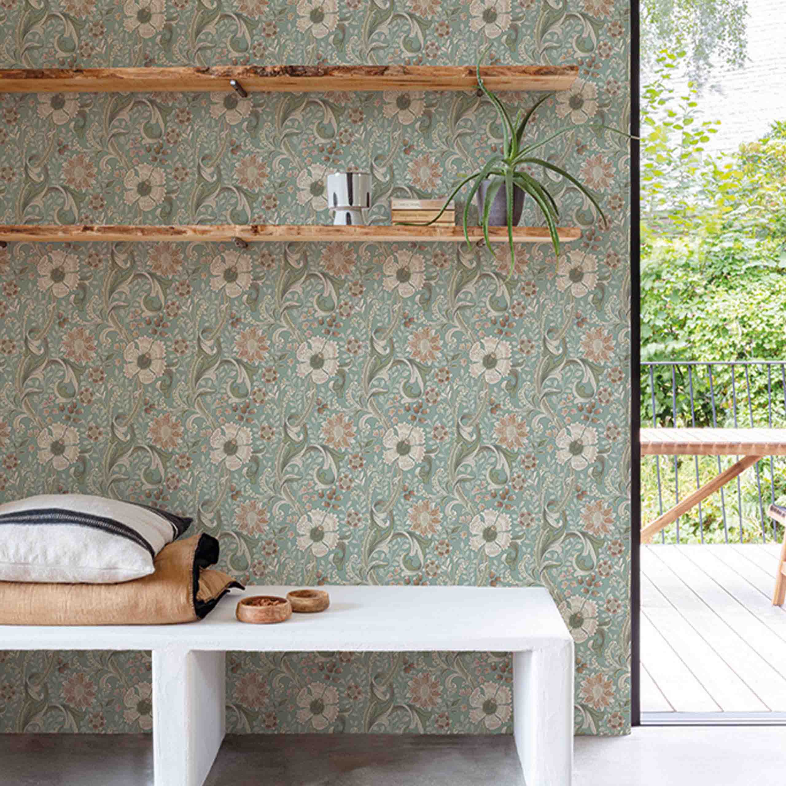 Blue non-woven wallpaper with intricate leaf patterns in a modern room setting.