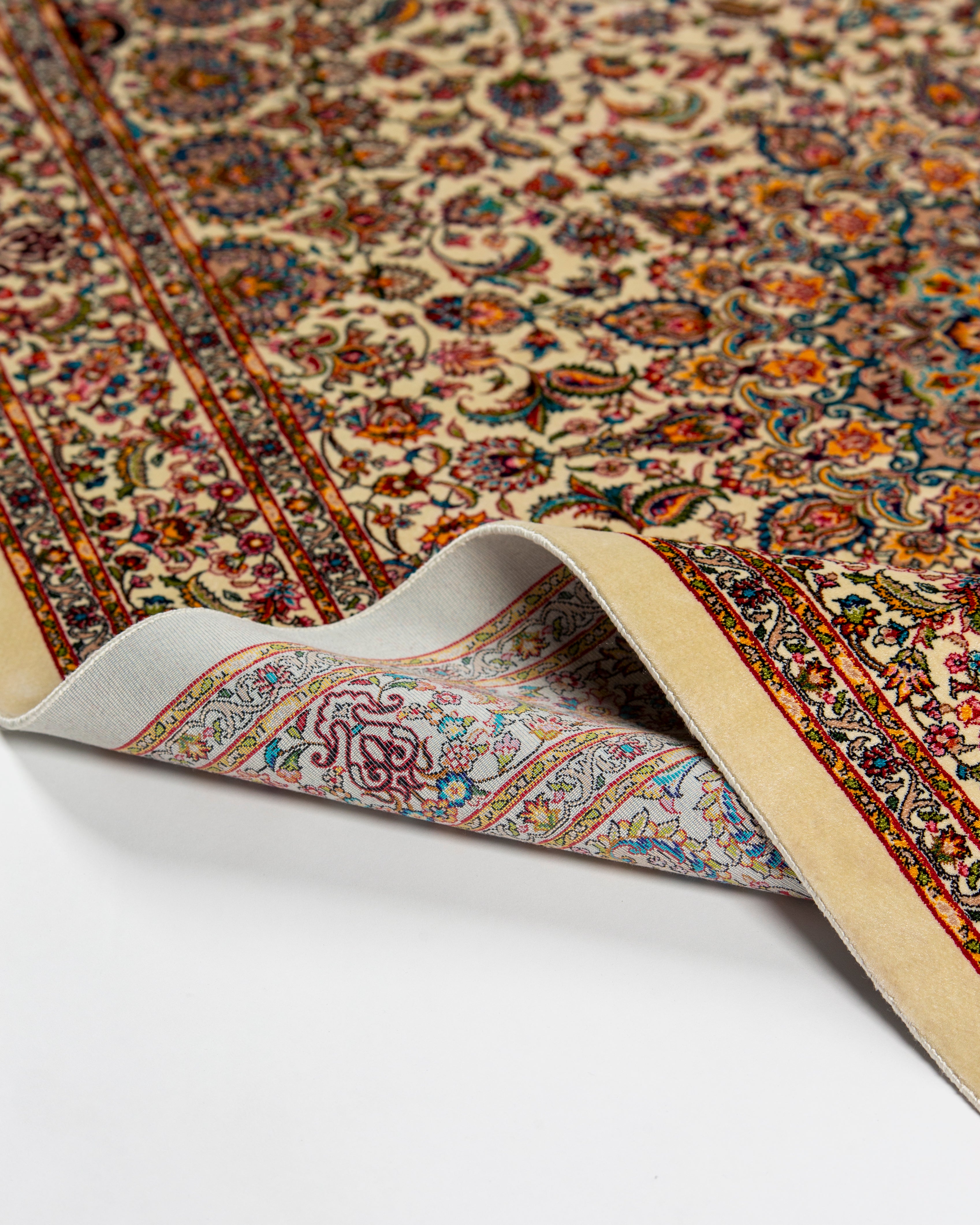 Floral field detail of the Yasmin silk rug