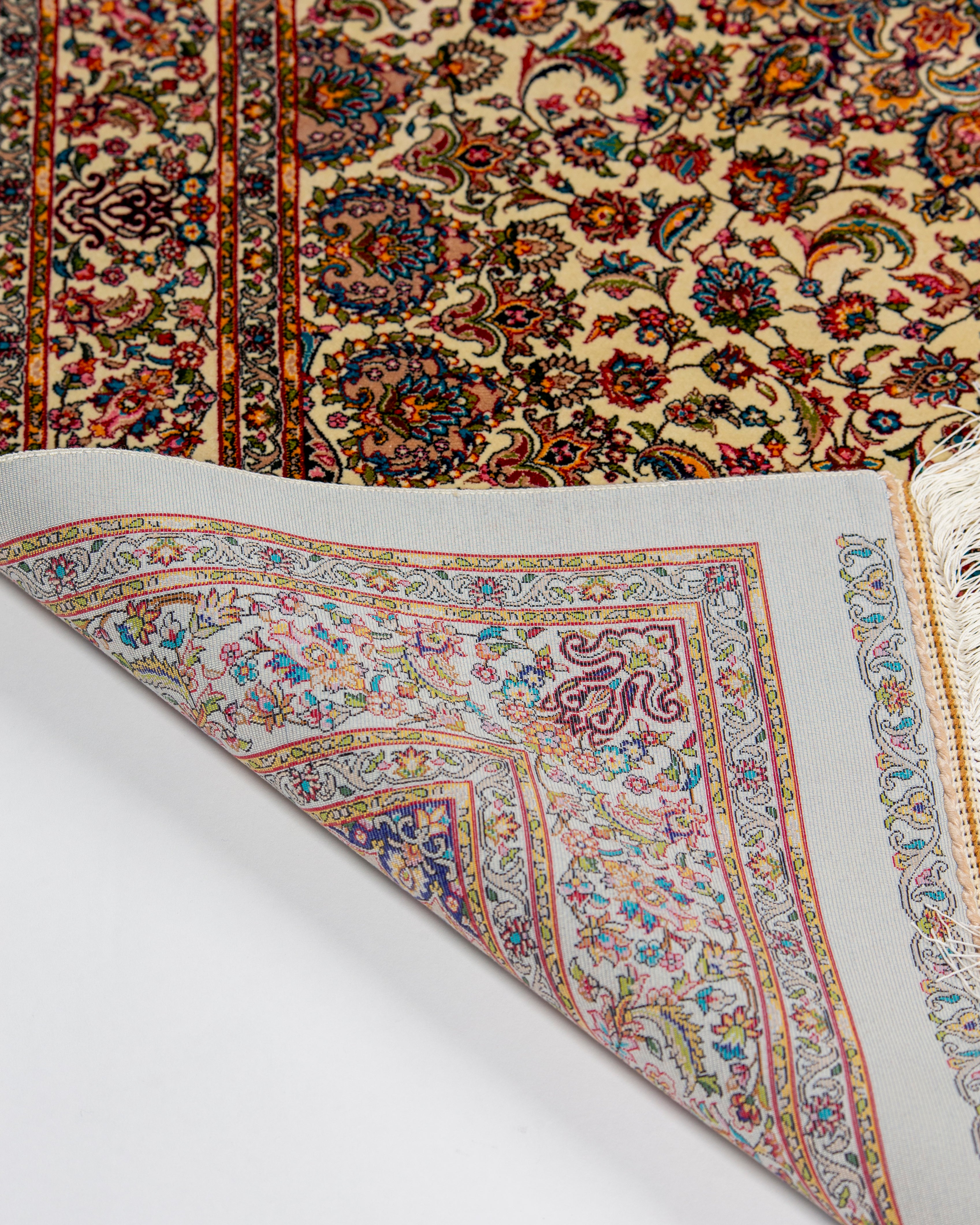 Medallion and field detail of the Yasmin ivory silk rug