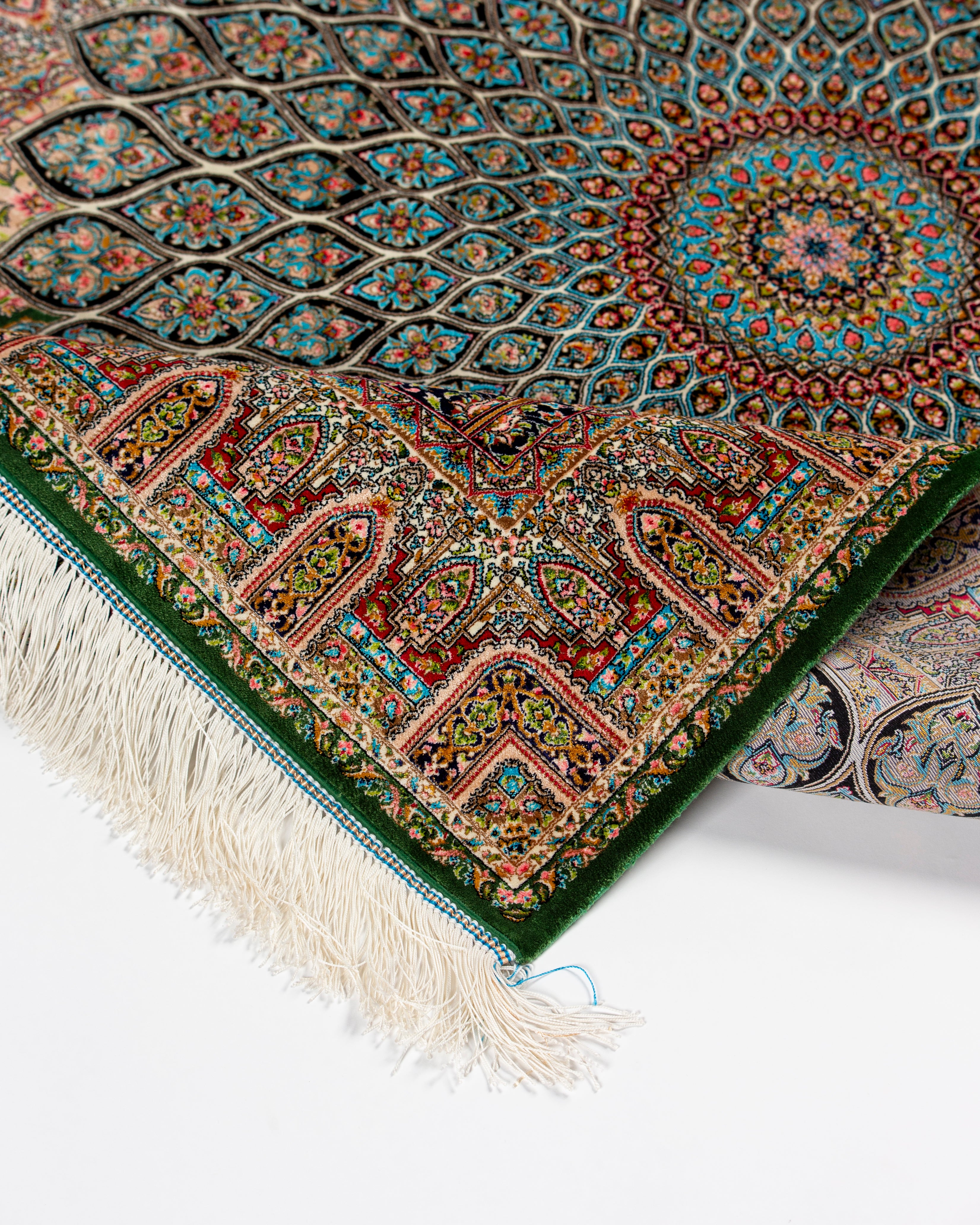 Emerald green border and mihrab detail of the Zumurrud silk rug