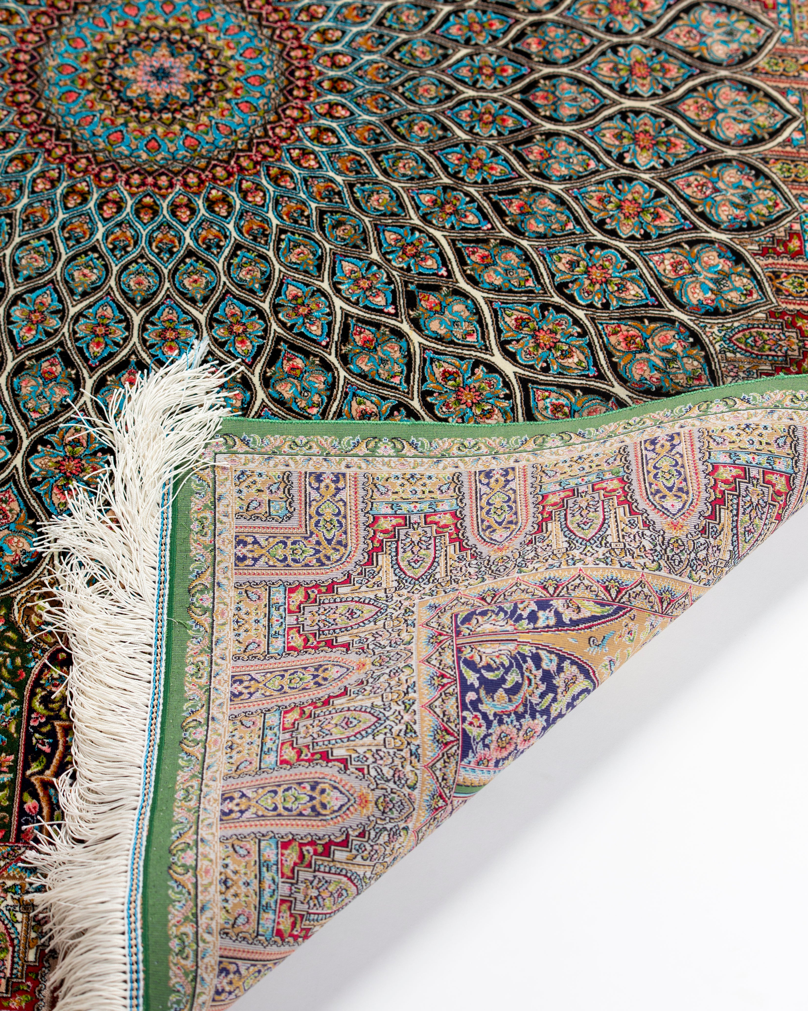 Corner and green border detail of the Zumurrud silk rug