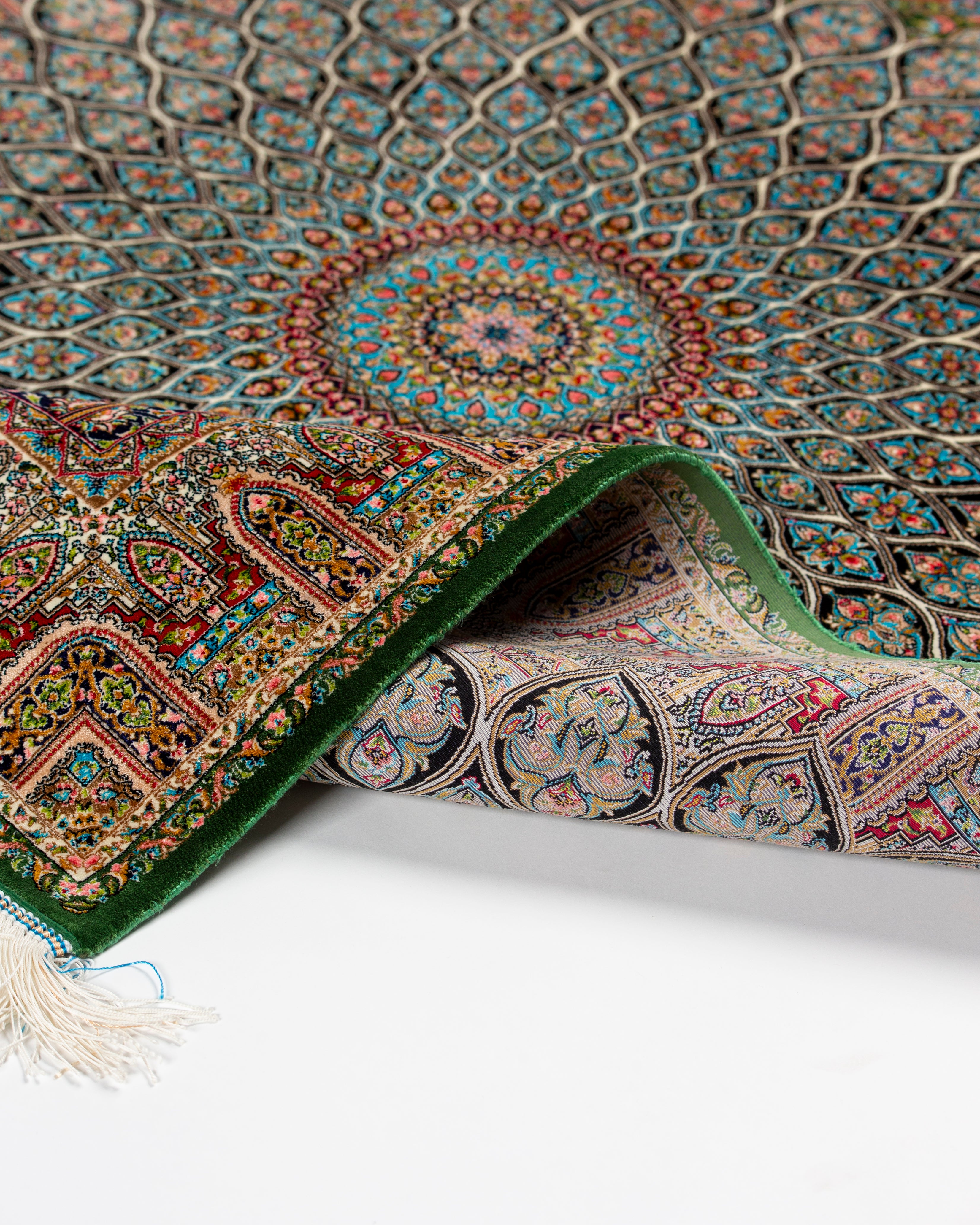 Field pattern detail of the Zumurrud green silk rug
